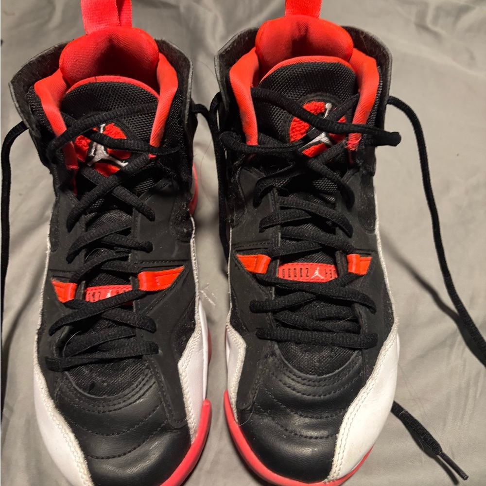 Nike Kids Black, Red, and White Basketball Jordan’s